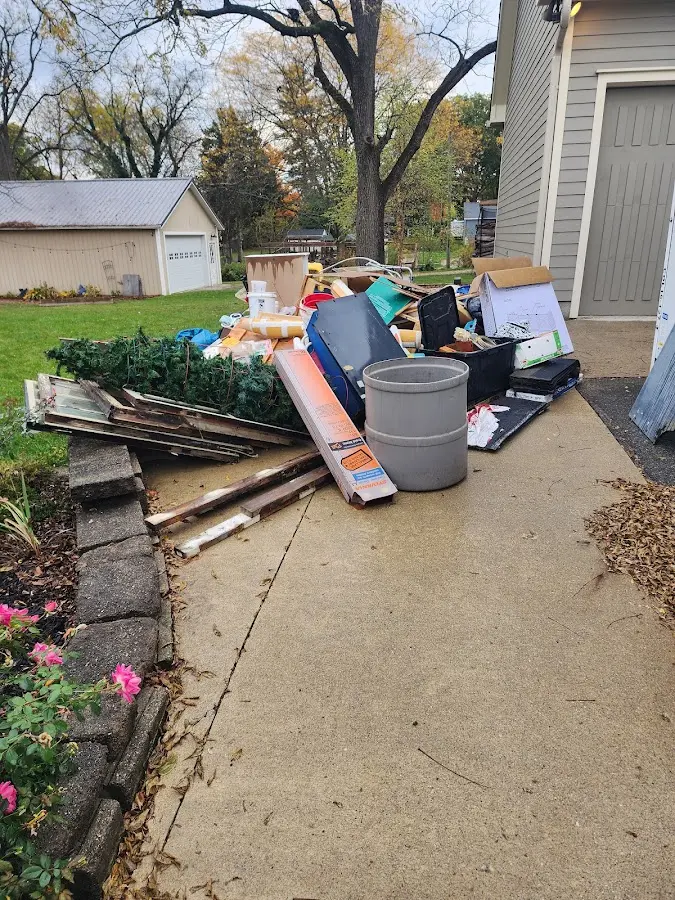 Dumpster being loaded with debris for Commercial Dumpster Rental in San Jose